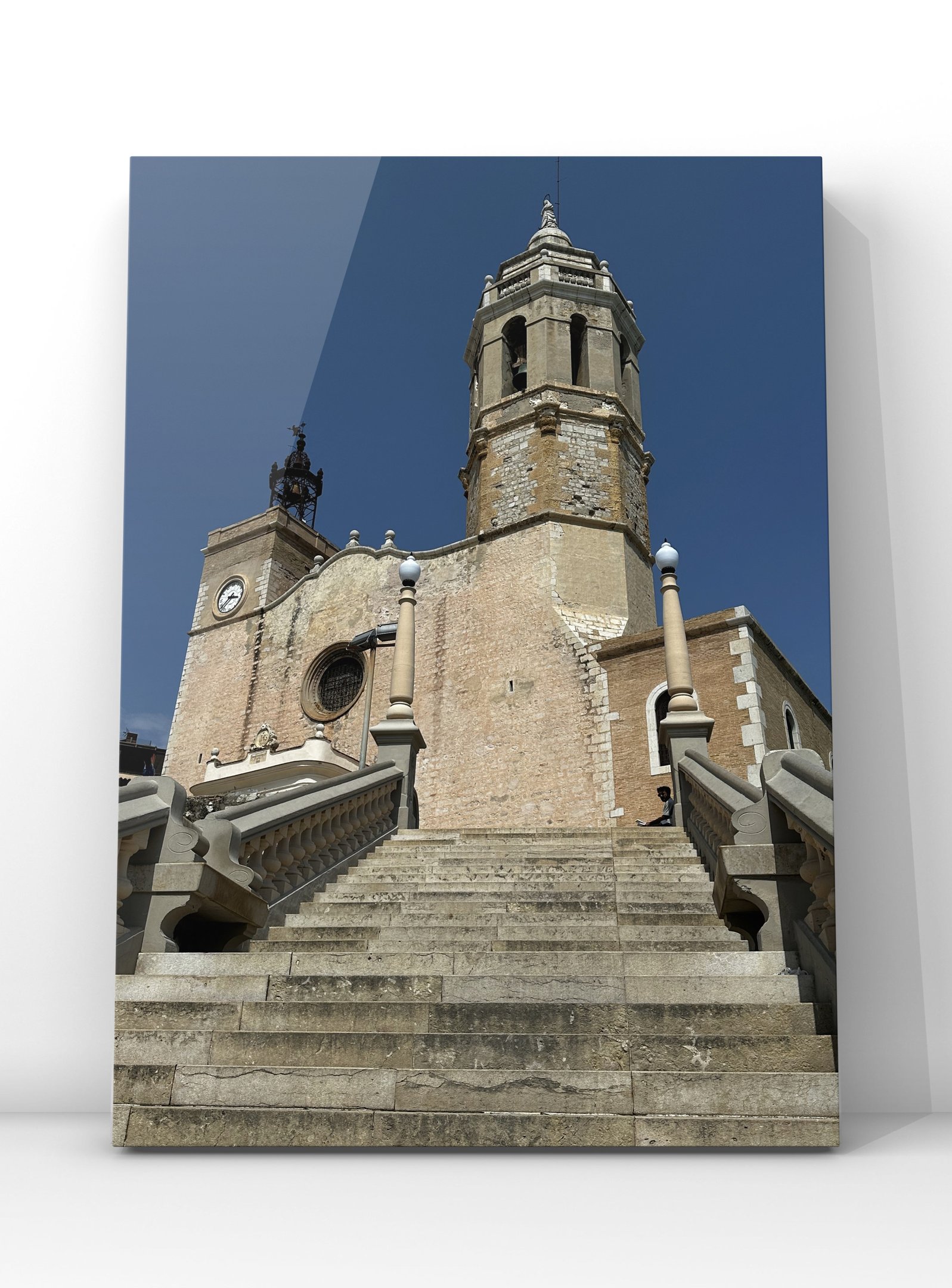 Photograph of Sant Bartomeu and Santa Tecla Church in Sitges, Spain, overlooking the Mediterranean w